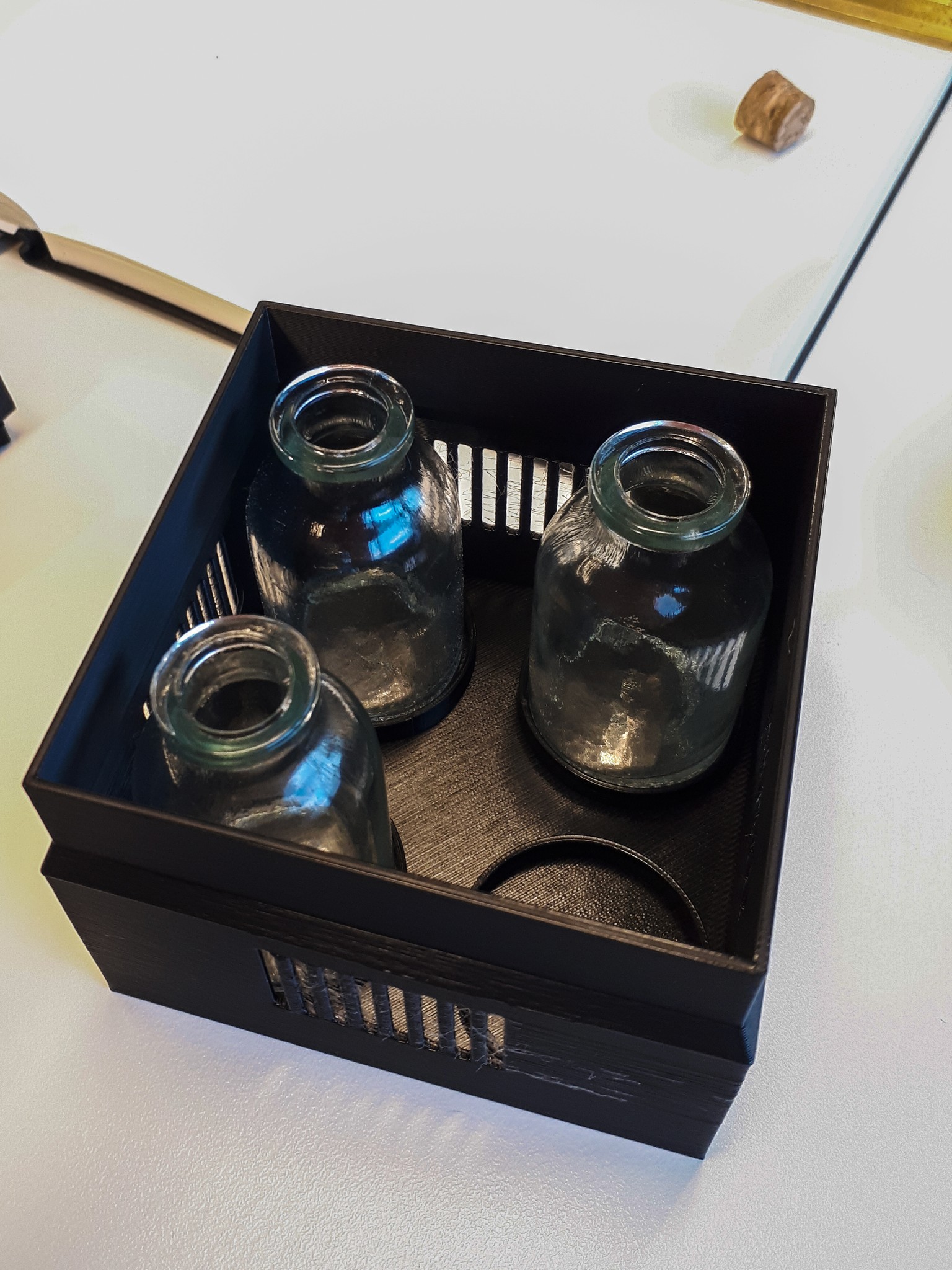 the fragrance box of the Scentony device holding three scent bottles