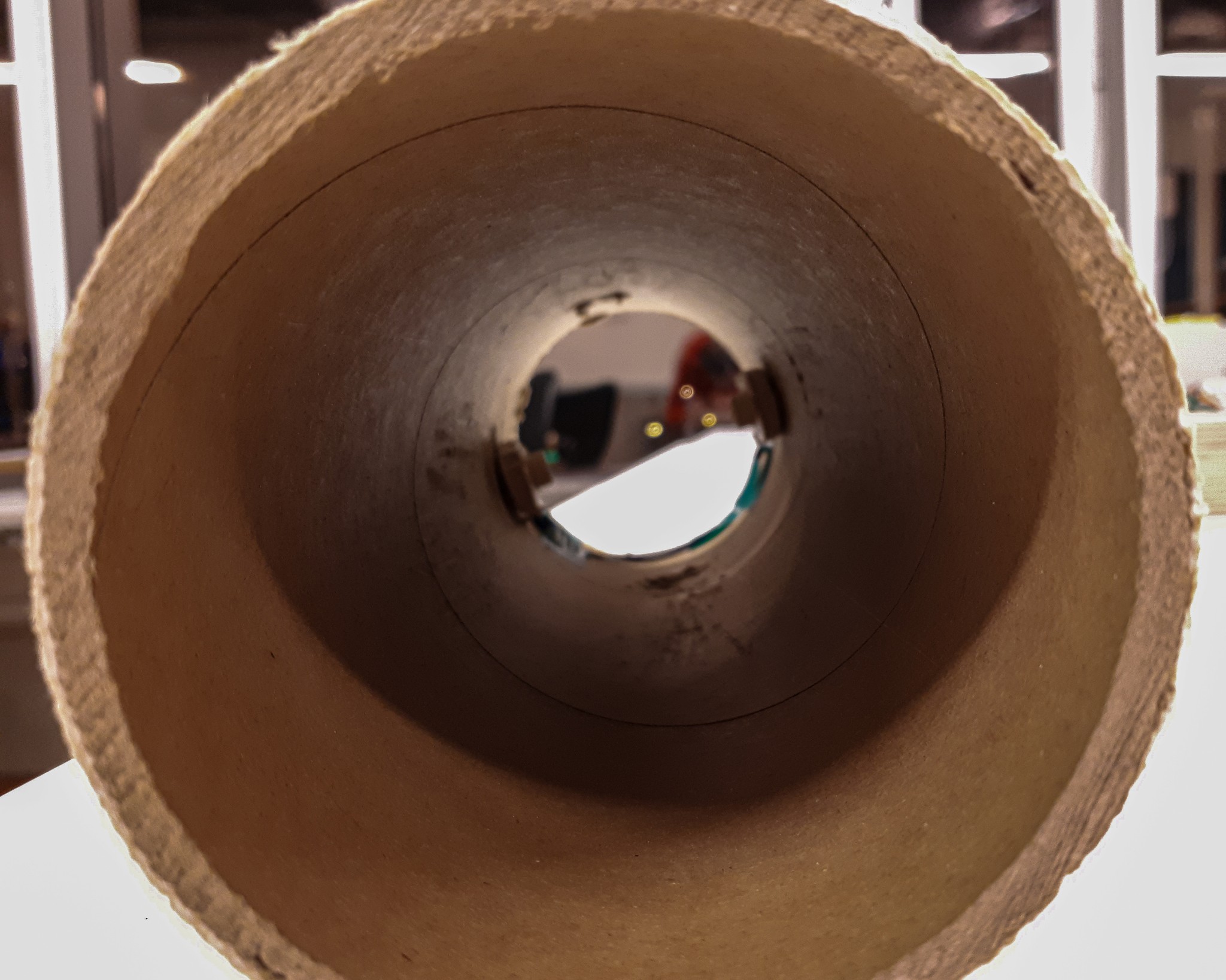a hard cardboard funneling system for scentony before mounting the fan